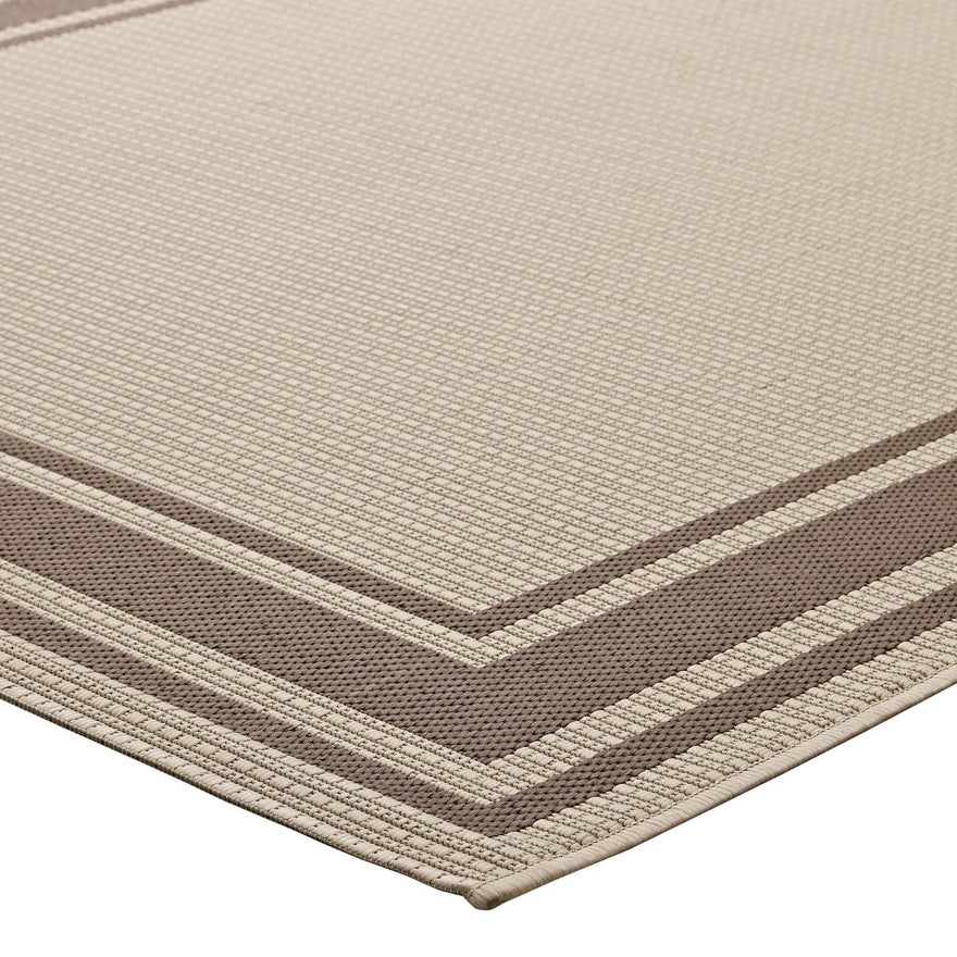 The Sutton Bordered Performance Indoor/Outdoor Area Rug