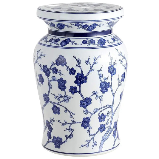 White ceramic stool with blue floral patterns on a white background