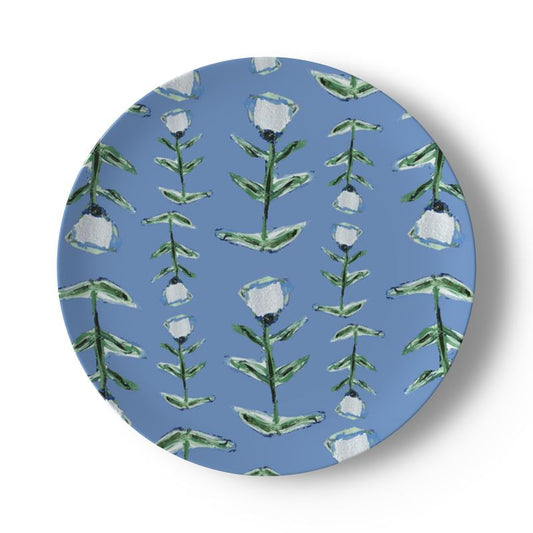 Round blue coaster with floral pattern on a white background
