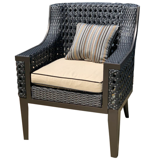 A dark woven outdoor armchair with a beige seat cushion and a striped accent pillow, shown on a plain white background.