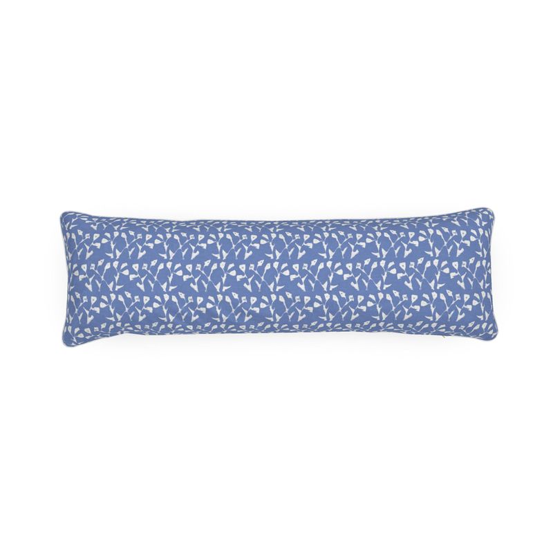 Blue pillow with white pattern on a white background