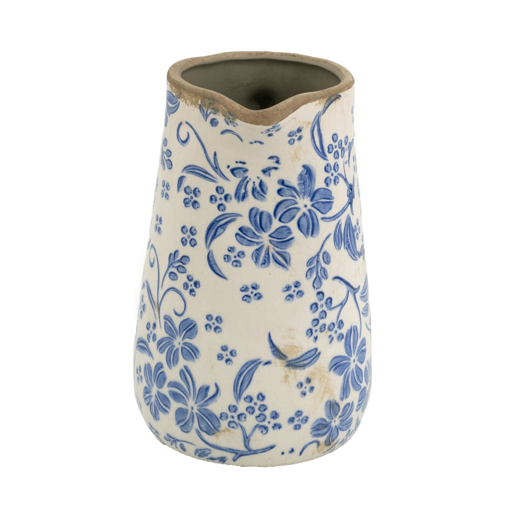 Ceramic pitcher with blue floral pattern on a white background