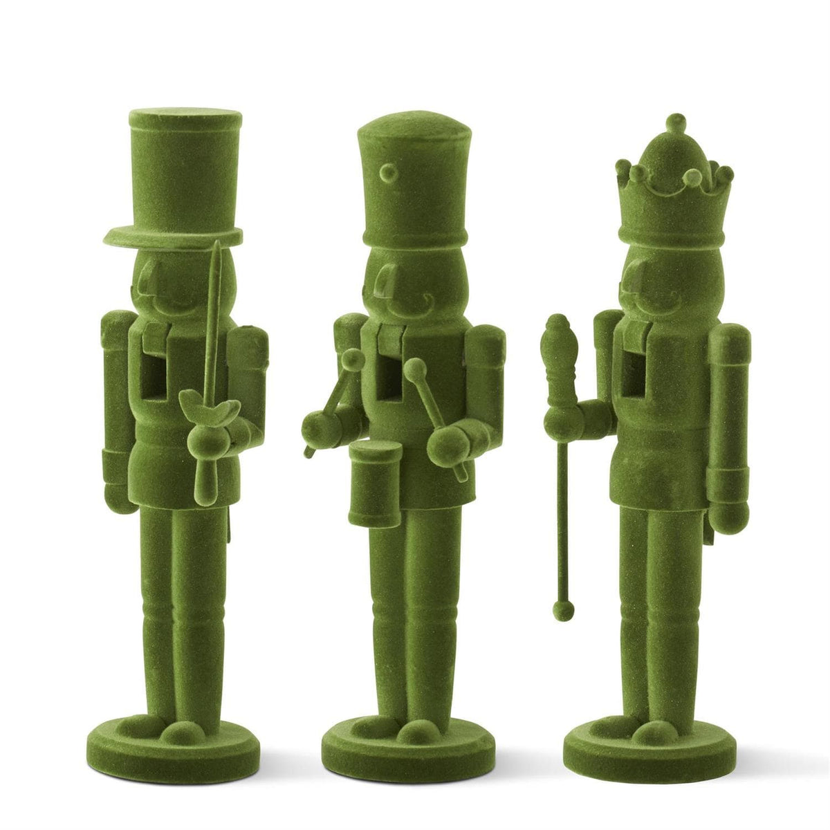 Three olive green toy nutcracker figurines standing side by side on a plain white background.