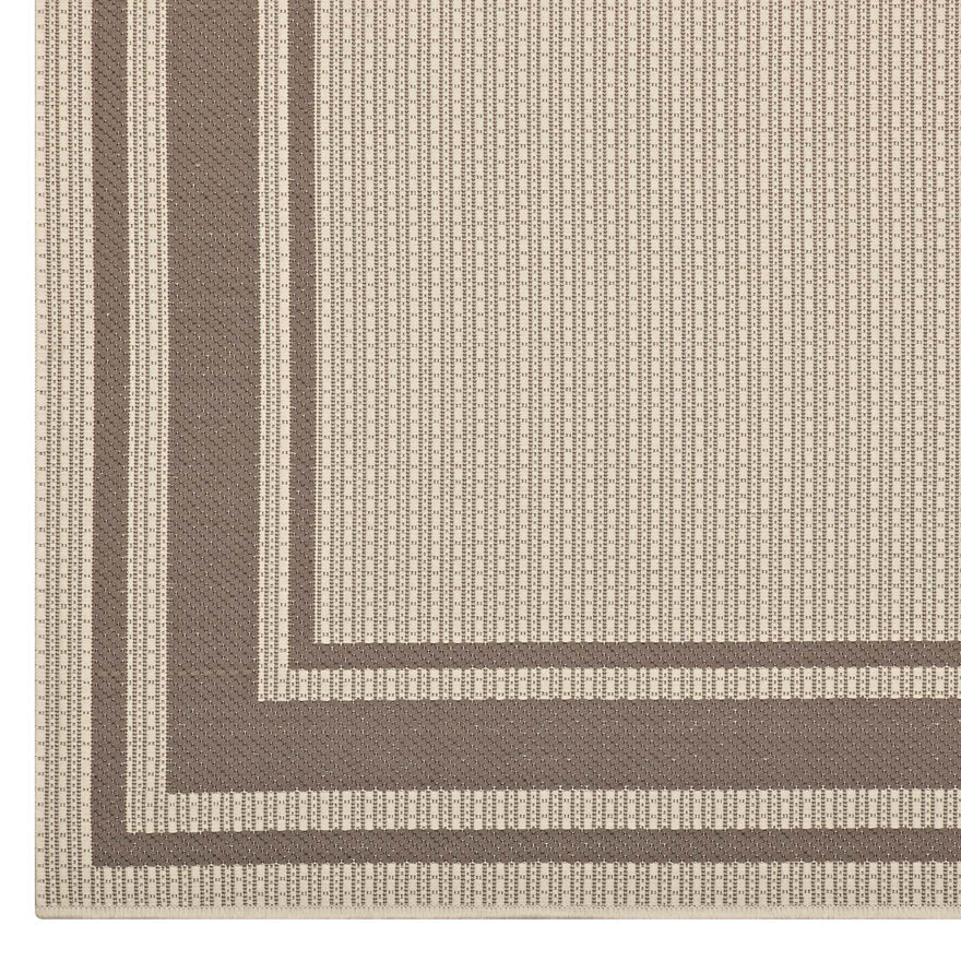 The Sutton Bordered Performance Indoor/Outdoor Area Rug