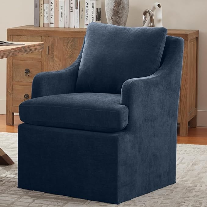 Blue armchair in a room with wooden furniture and decor