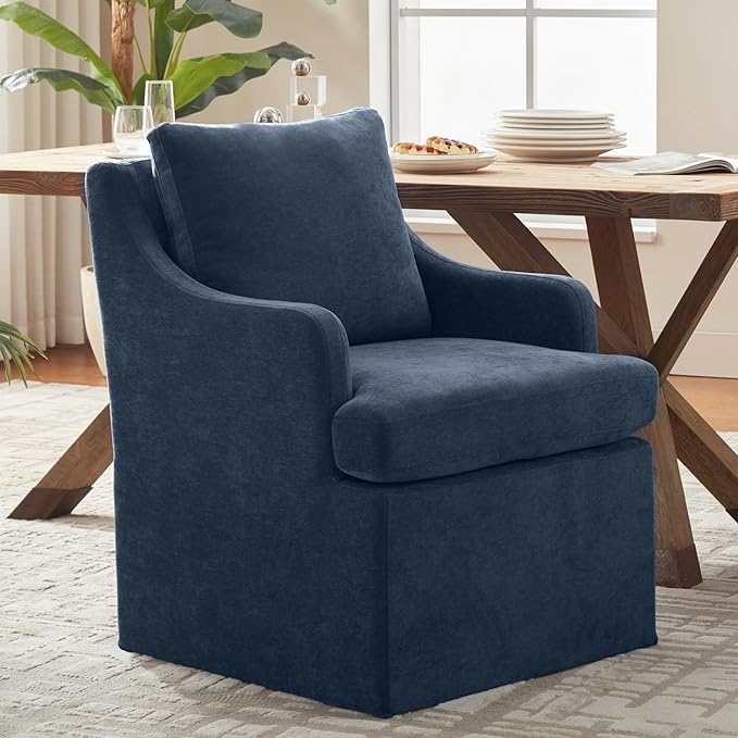 Blue armchair in a room with a wooden table and decor