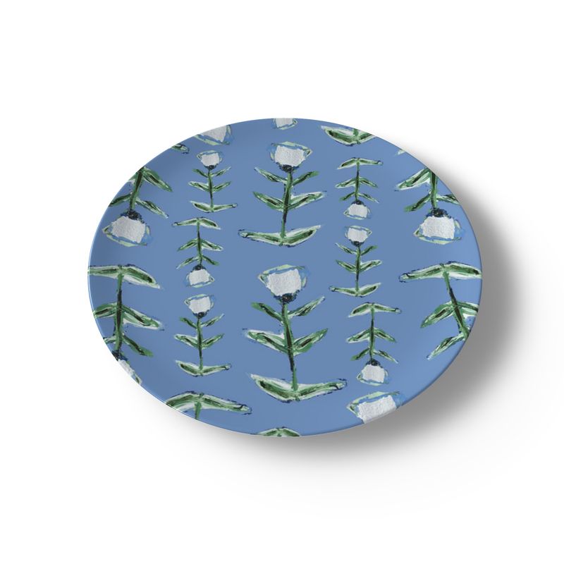 Round blue coaster with floral pattern on a white background