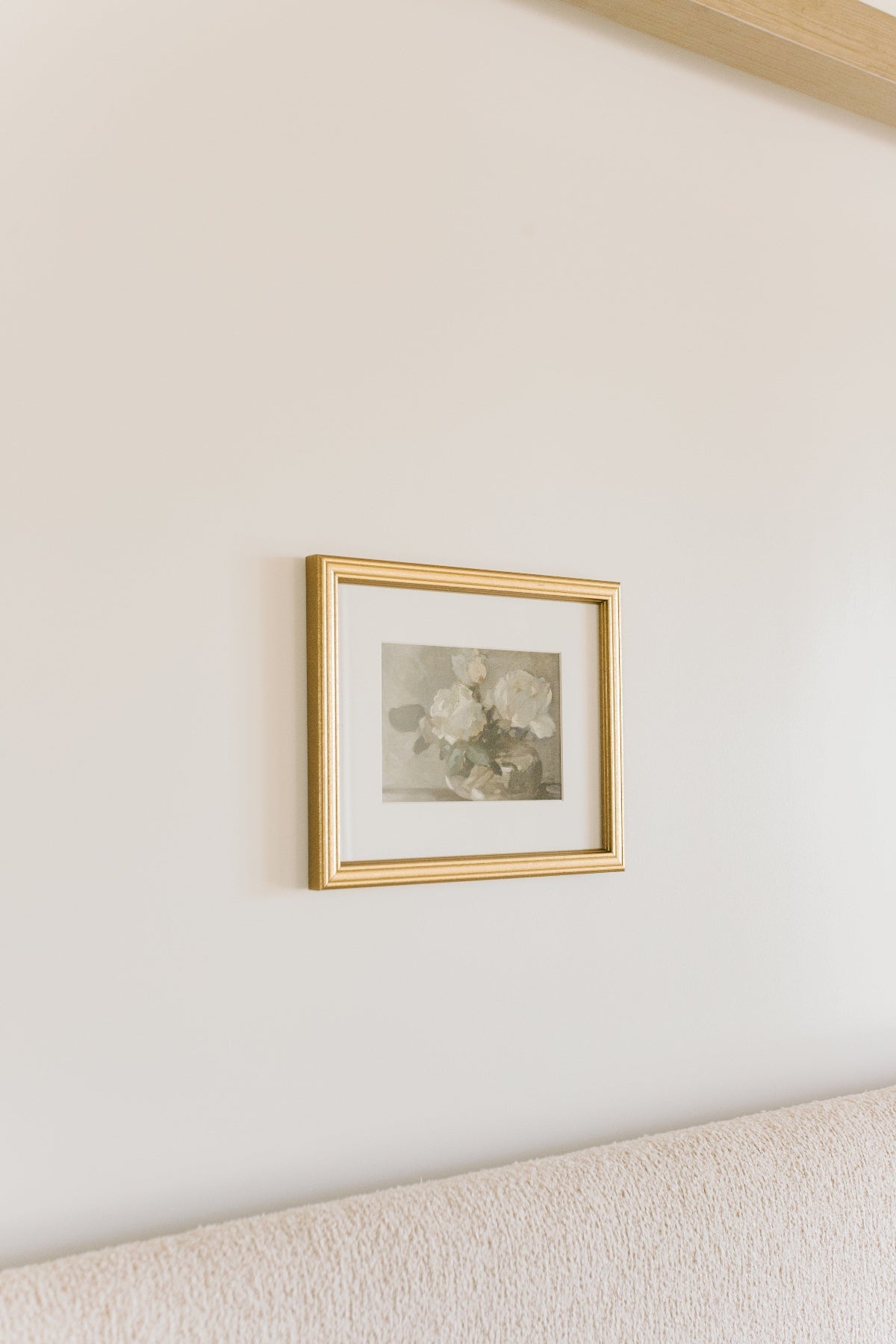 Framed artwork on a wall with a neutral color scheme