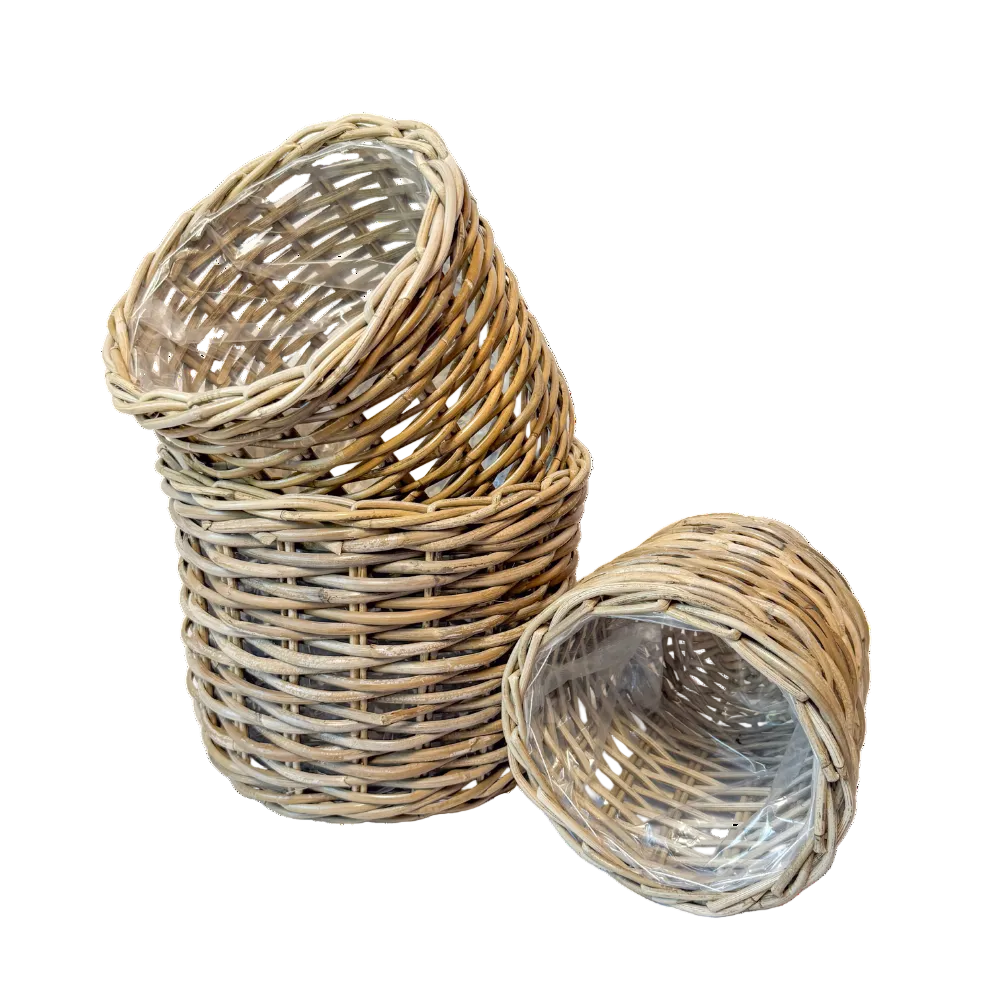 Three natural woven wicker baskets, including one stack of two and one single flat basket, shown on a plain white background.