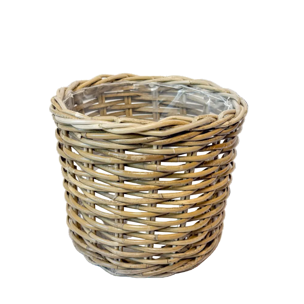 Wicker basket with a clear plastic liner on a white background