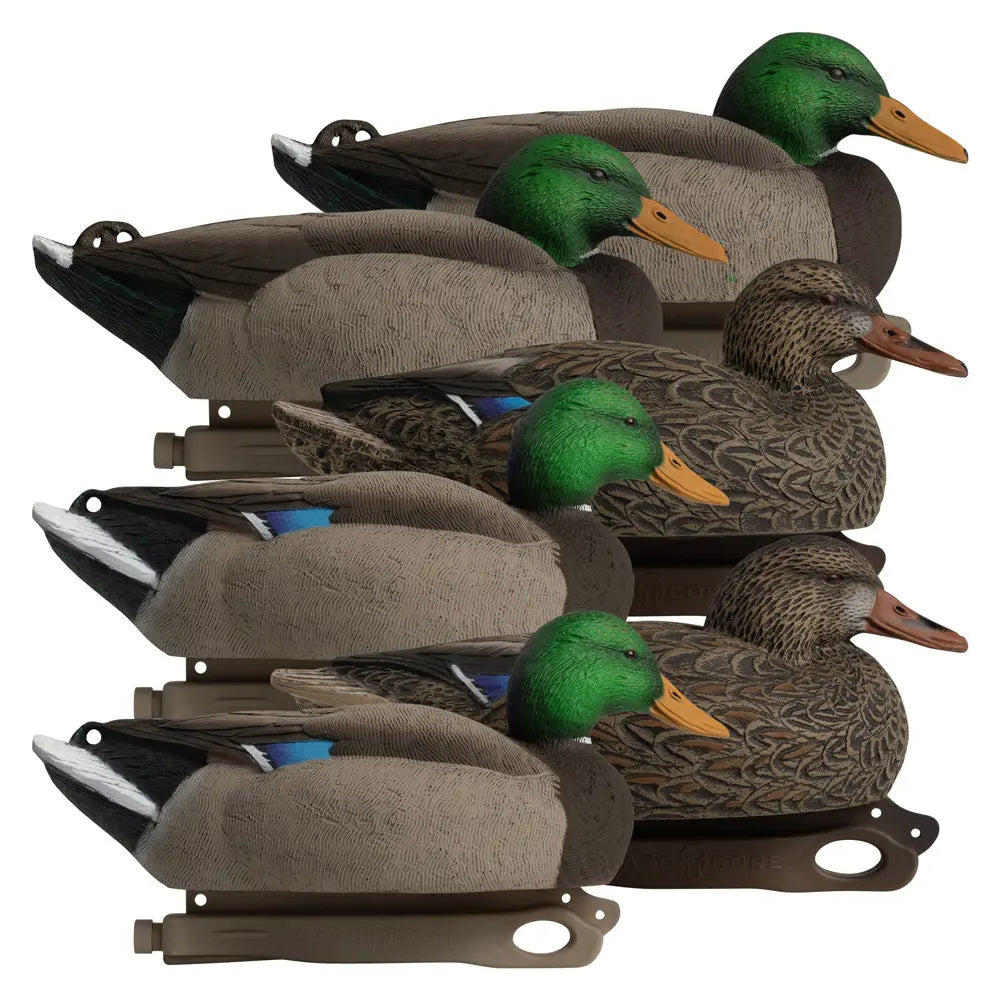 Stack of duck decoys with green heads and brown bodies on a white background
