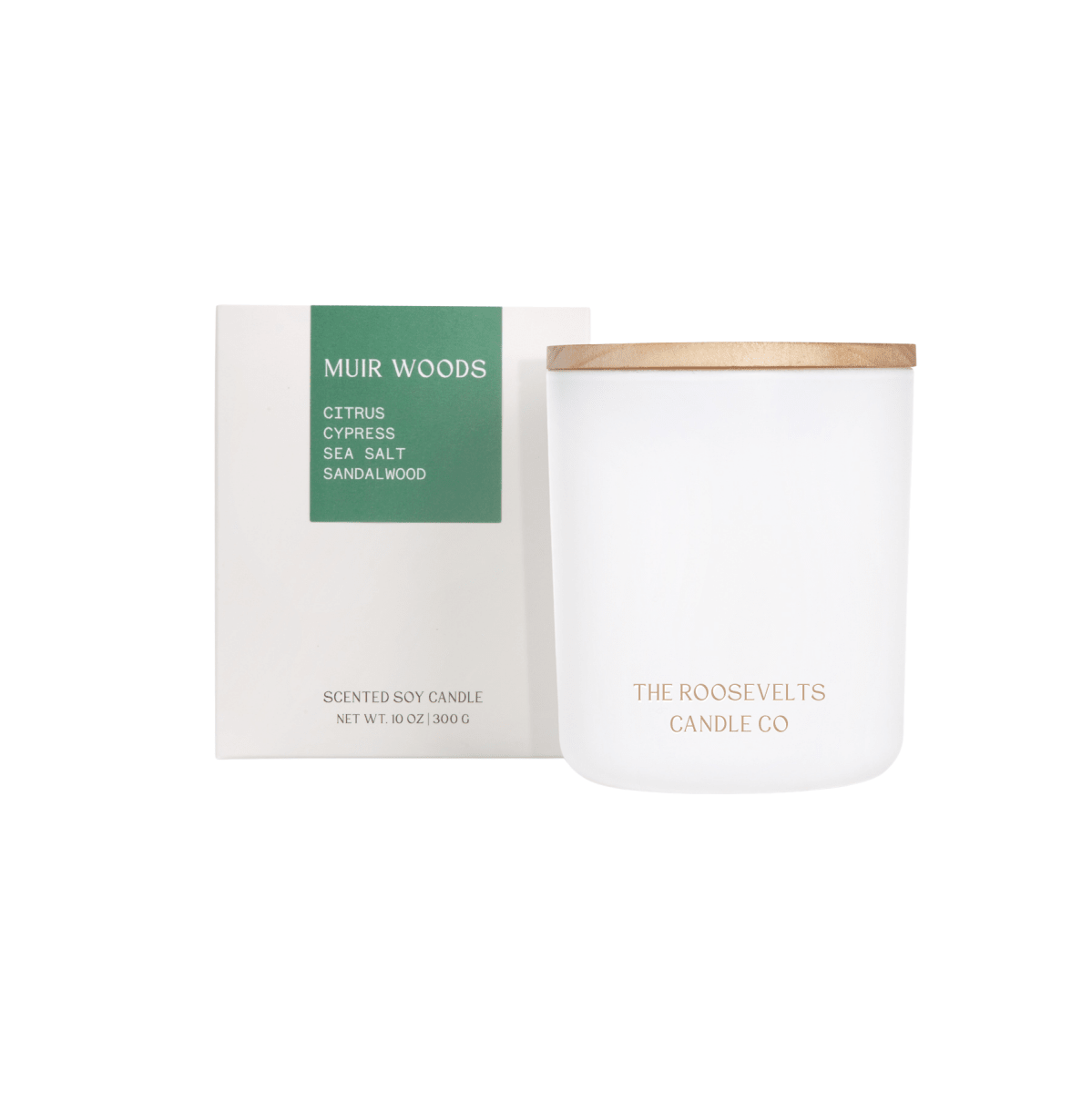 White candle with wooden lid and packaging labeled 'Muir Woods' on a white background