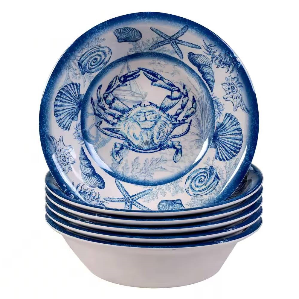 Set of ceramic plates with blue crab and shell design on a white background