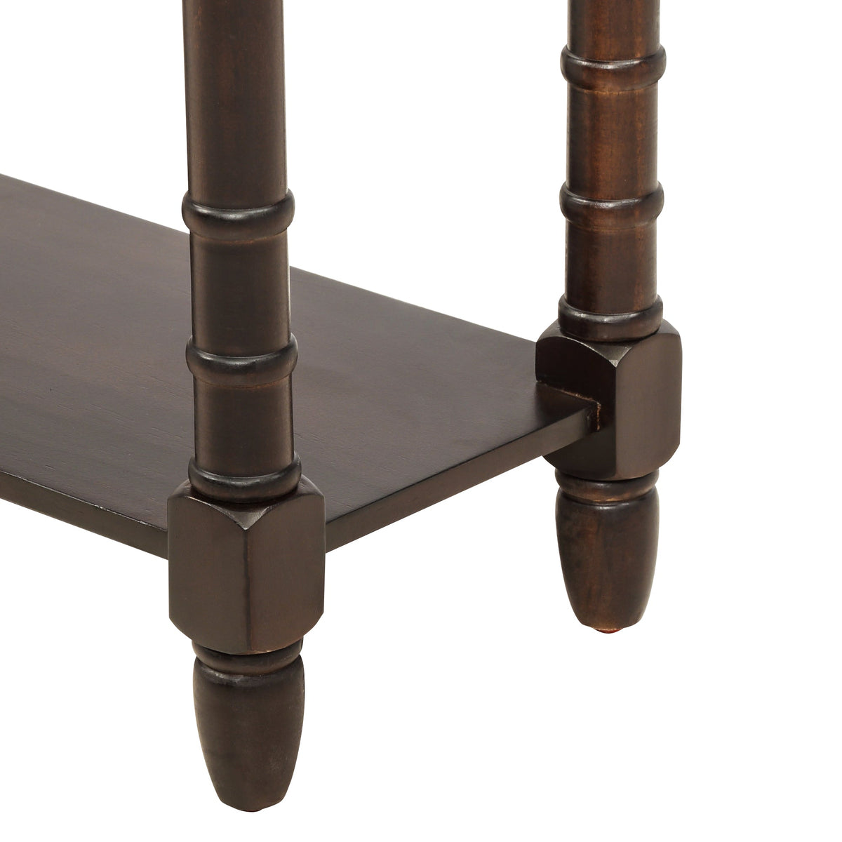 Close-up of a dark wooden side table with turned legs on a white background