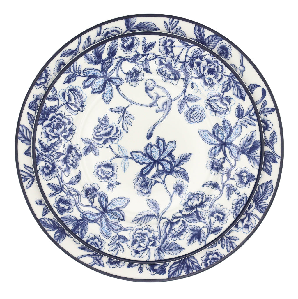 Decorative plate with blue floral and monkey design on a white background