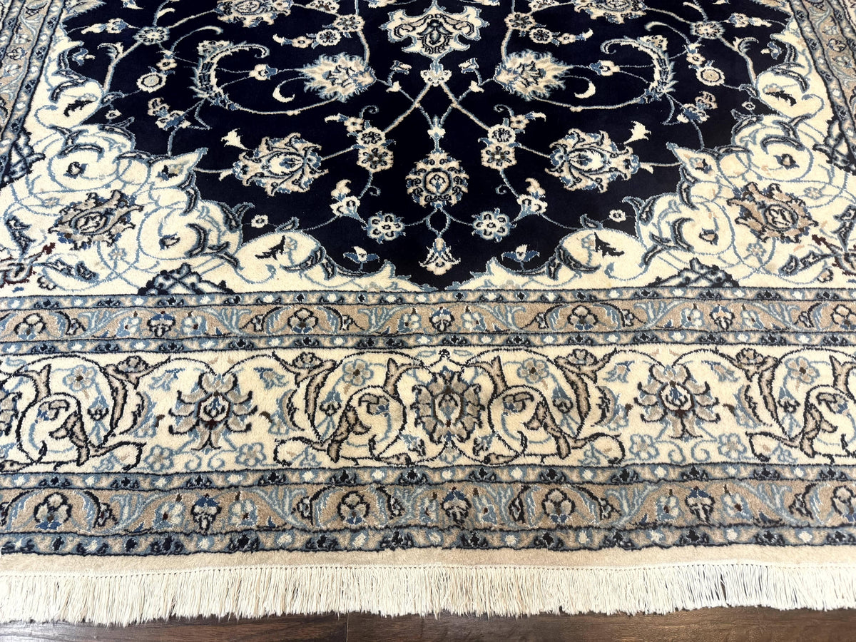 Decorative rug with intricate patterns on a wooden floor