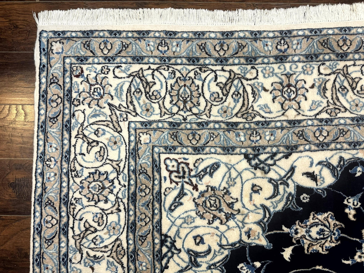 Close-up of a patterned rug on a wooden floor