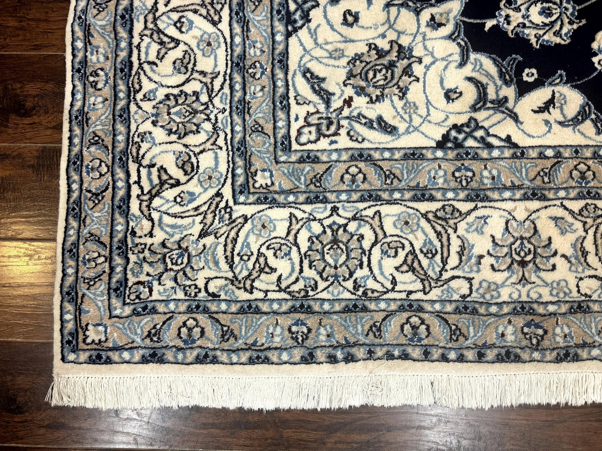 Close-up of a patterned rug on a wooden floor