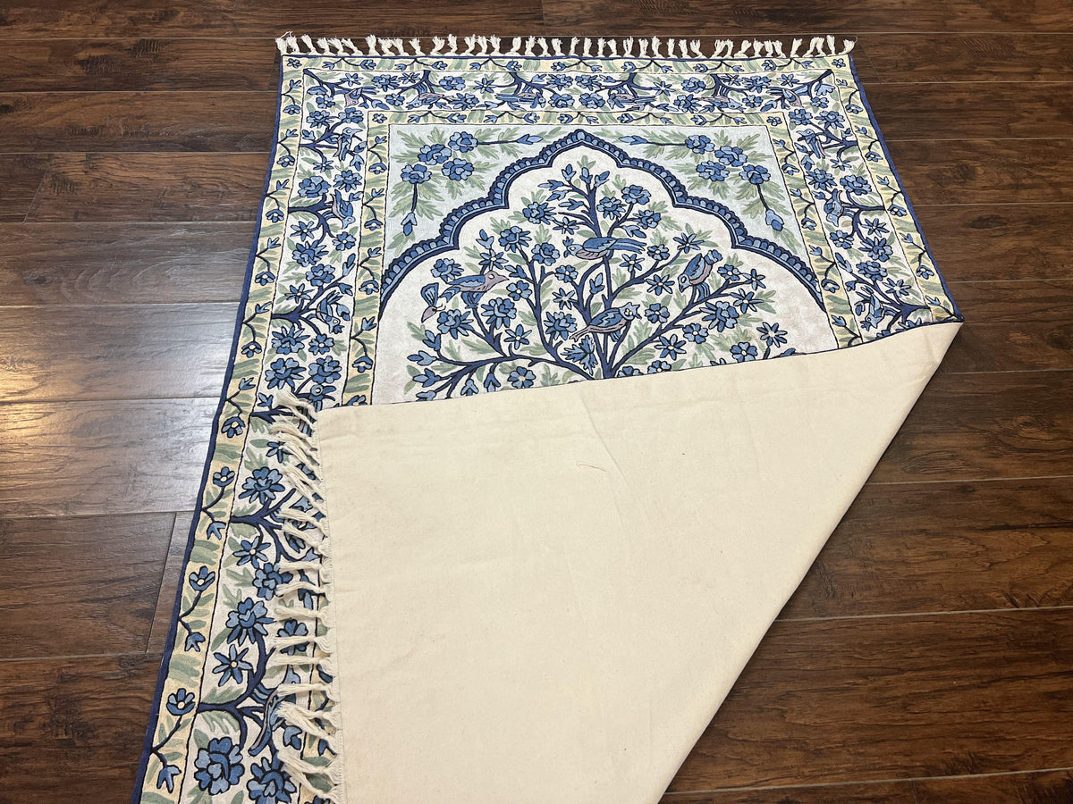 Decorative rug with floral pattern on a wooden floor