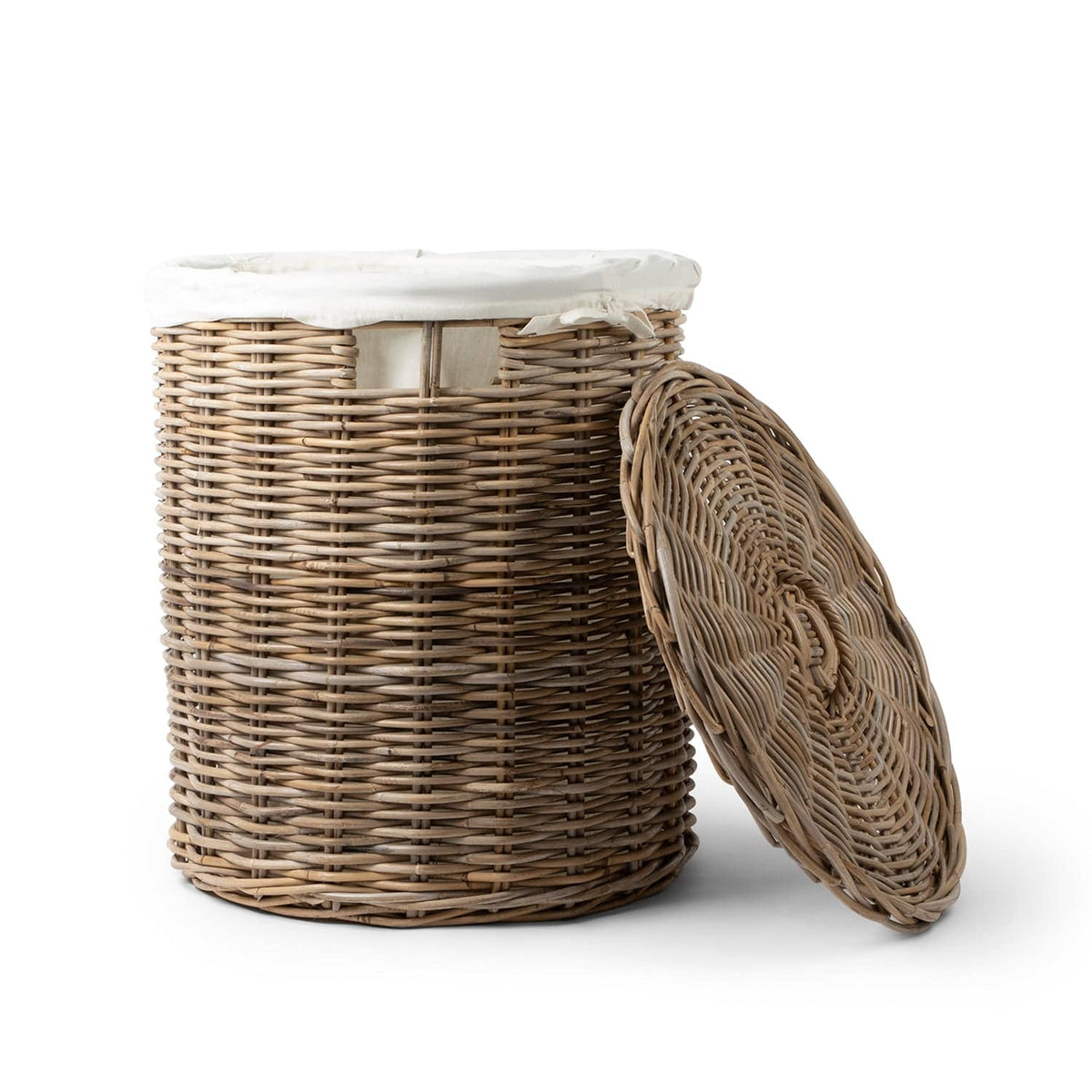 Wicker laundry basket with a white lid on a white background