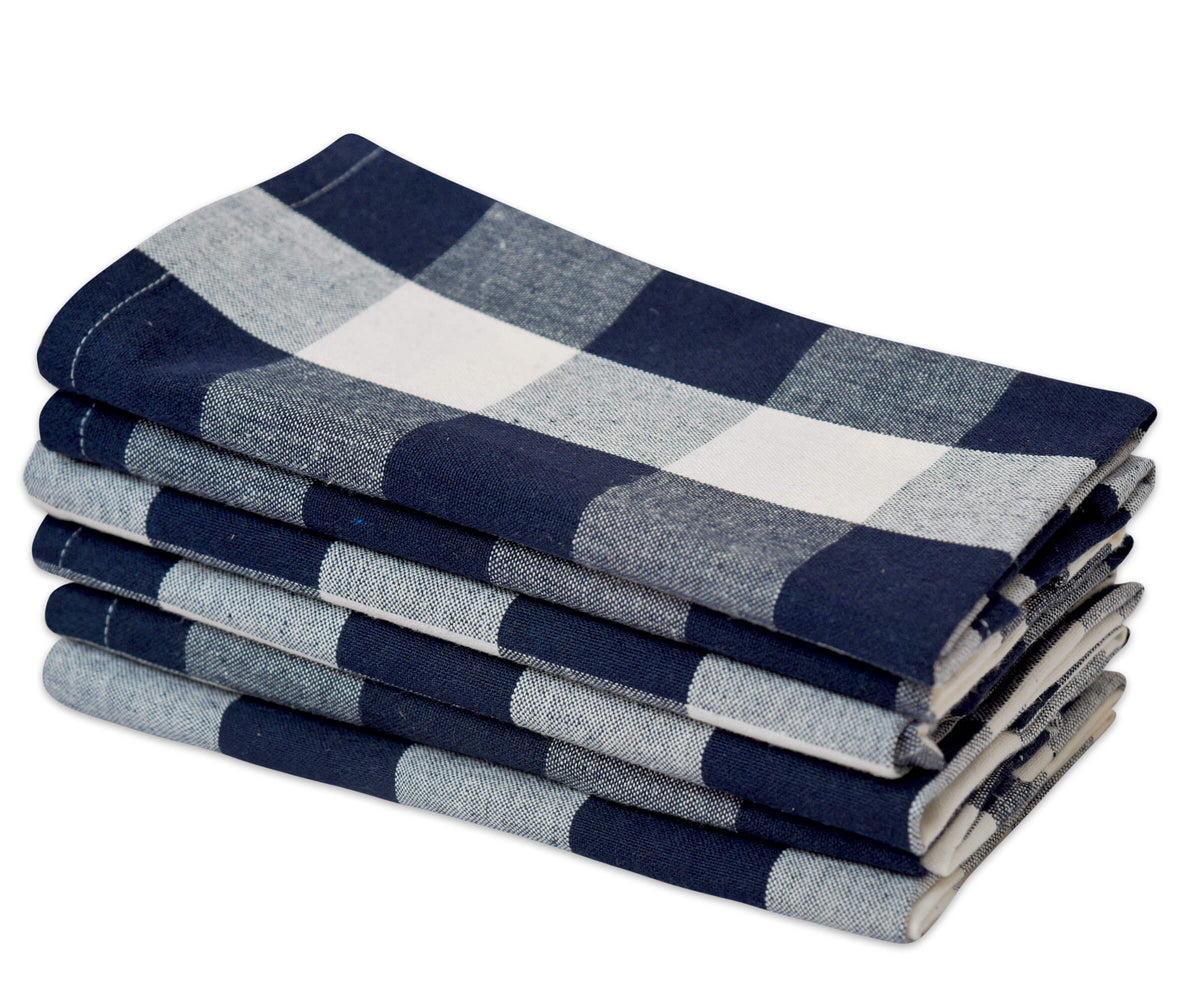 Stack of blue and gray checkered napkins on a white background