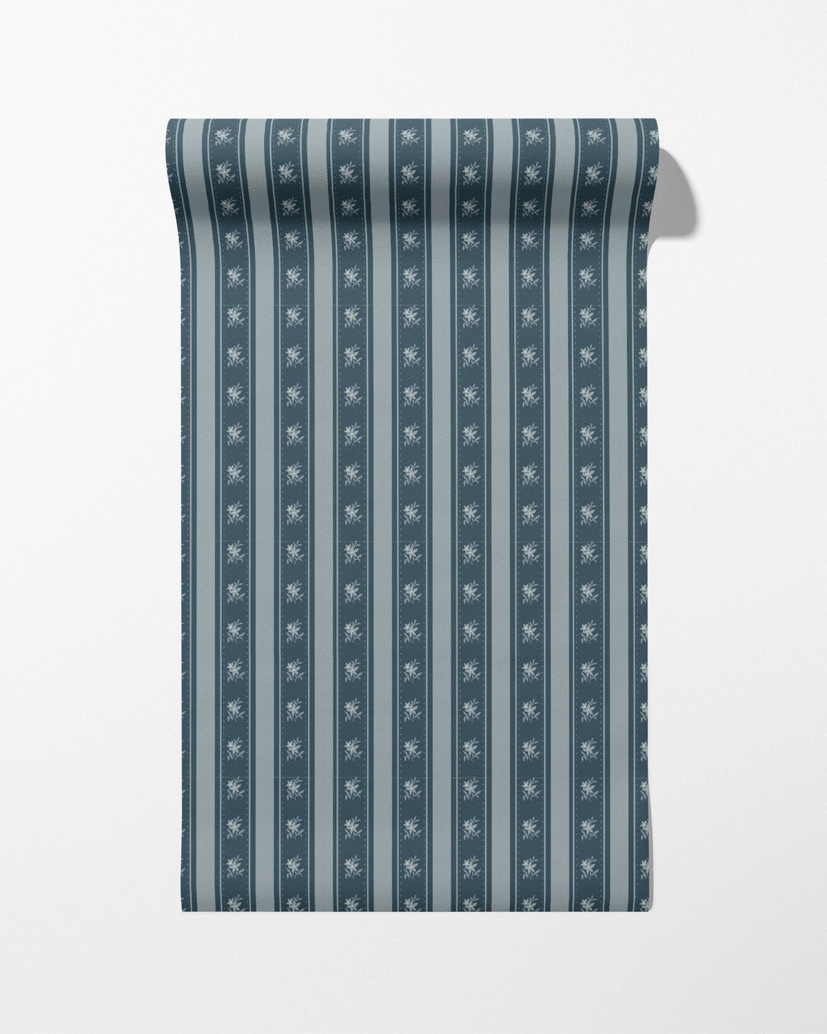 Roll of blue and white striped fabric with a subtle pattern on a light gray background