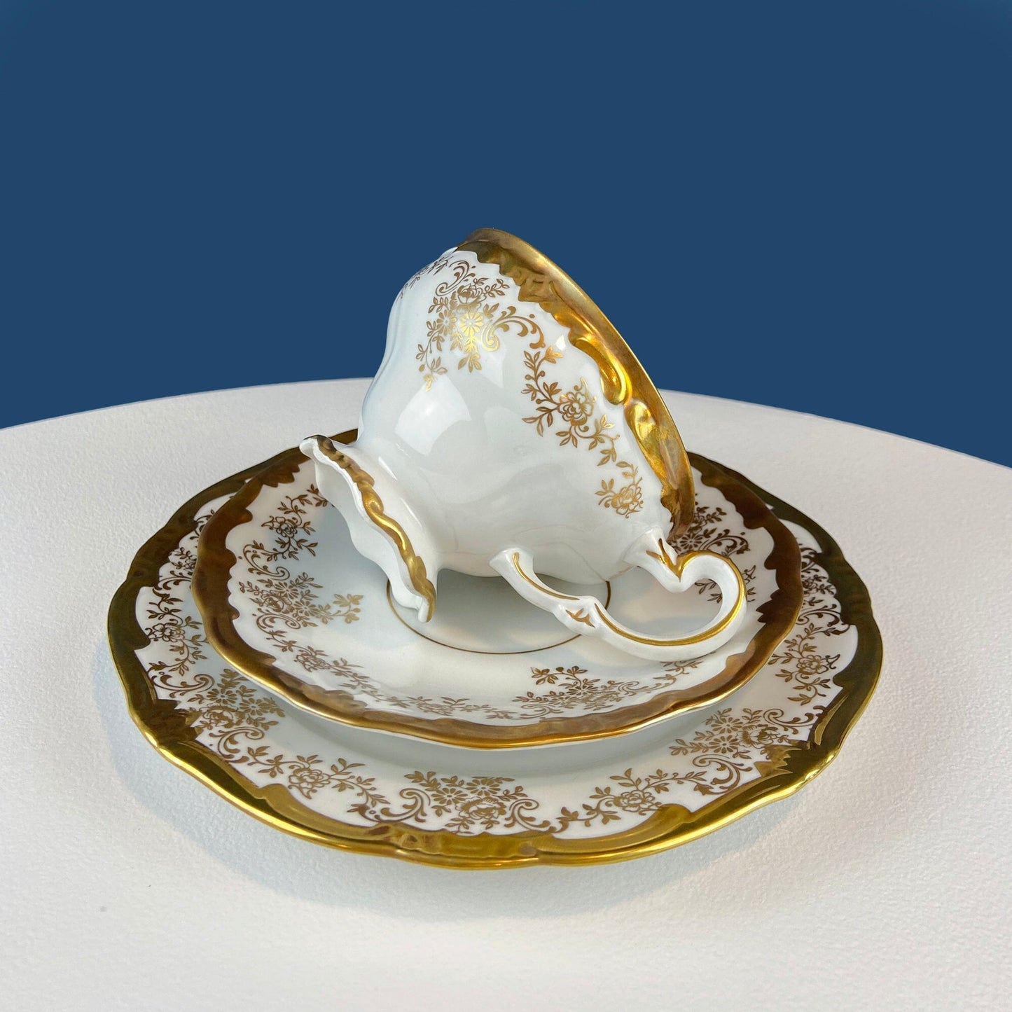 White and Gold Cup and Saucer. Paragon Porcelain, By Appointment to Her Majesty the Queen Potters. Dining Room Cabinet Display.